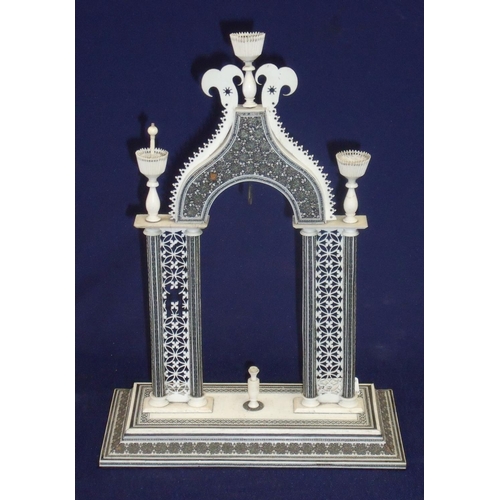 172 - 19th C Anglo-Indian Vizagapatam style pocket watch holder in the form of arch supporting three urns ... 