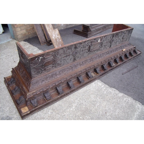 191 - Large stepped carved oak cornice, the top with carved bracket supports above a carved and panelled f... 