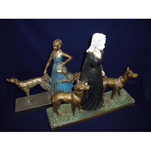 24 - Two similar mid 20th C French plaster figures depicting lady with dogs on rectangular bases, one mar... 