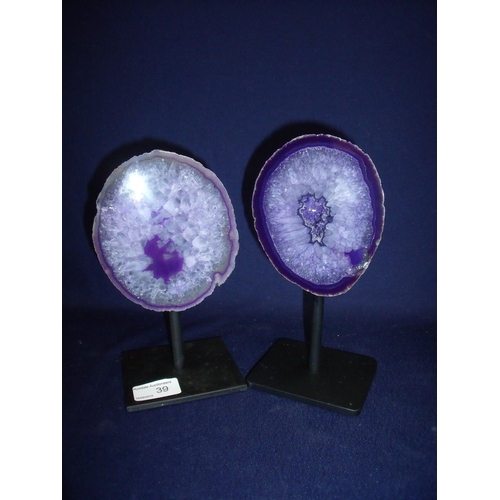 39 - Pair of purple amethyst type geodes mounted on metal bases (approx. 21cm high)