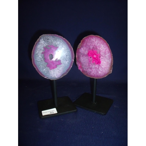 40 - Pair of mounted pink coloured geodes on metal stands (approx. 21cm high)