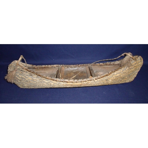 41 - 19th/20th C birch bark model of a Canadian type canoe (overall length 60cm)