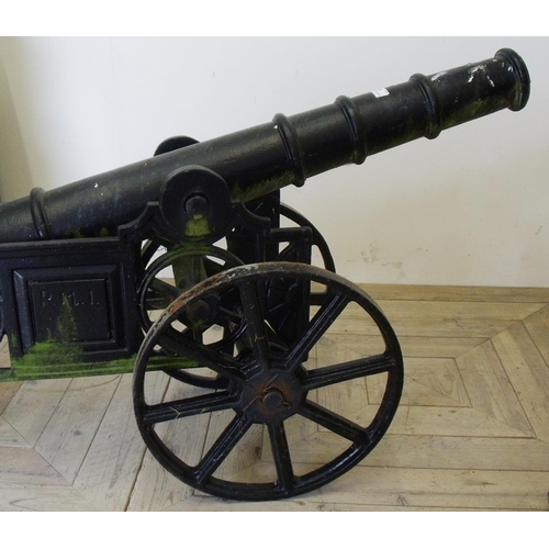 59 - Large cast metal decorative garden cannon on carriage (overall length 156cm)