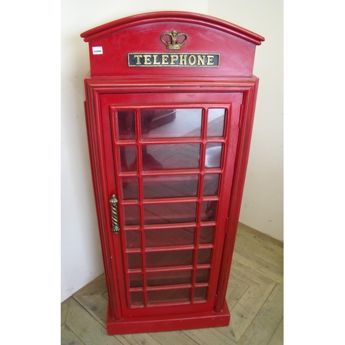 66 - Bookshelf in the form of a red telephone box enclosed by single glazed door (46cm x 27cm x 120cm)