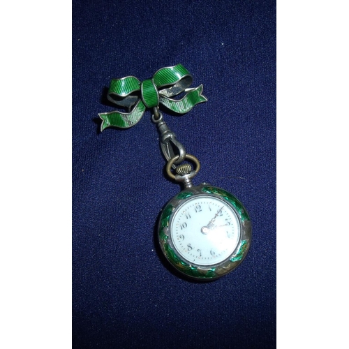 116 - Ladies silver and enamel fob watch with enamel and seed pearl bow hanging pendant with Swiss movemen... 