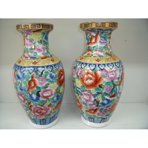 106 - Pair of Chinese ceramic vases with floral detail (height 36.5cm)