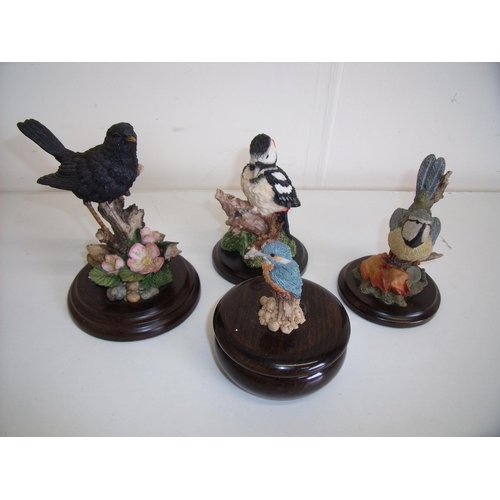 124 - Group of four Country Artist bird figures on wooden plinths