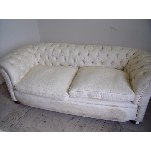 366 - Victorian upholstered horsehair filled two seat Chesterfield style sofa on turned mahogany supports ... 