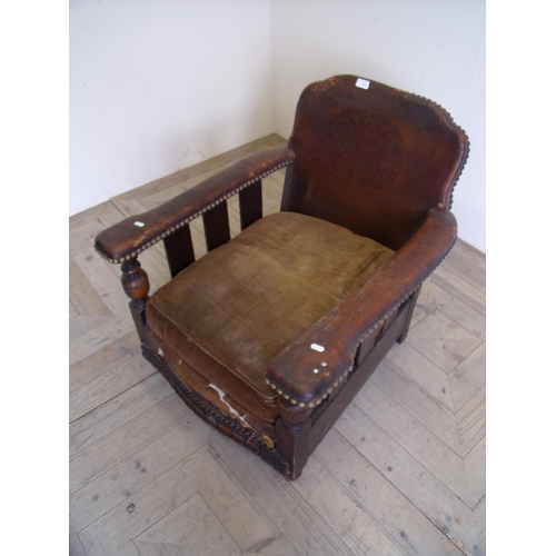 374 - 1920/30s leather framed club style chair on turned oak supports