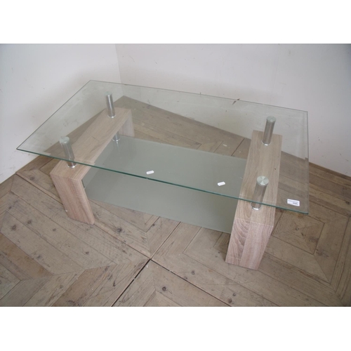 395 - Modern glass top coffee table on four steel supports with frosted glass under-tier (110cm x 60cm x 4... 