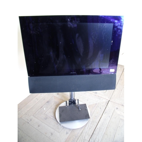 405 - Bang & Olufsen flat screen TV on stand (26inch) lacking all accessories and leads (sold as seen)