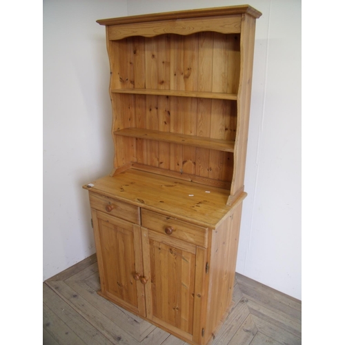 417 - Modern pine dresser with two tier raised back above two drawers and two cupboard doors (width 85cm)