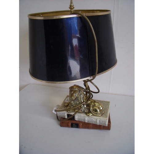 48 - Decorative brass table lamp in the form of a lion seated on books