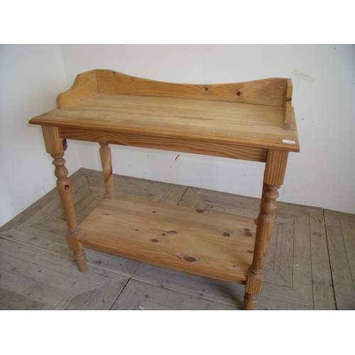 413 - Modern pine two tier wash stand with raised back and sides on turned supports and under tier (100cm ... 