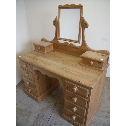 412 - Quality modern pine dressing chest with raised mirrored back, two drawers, kneehole centre and four ... 