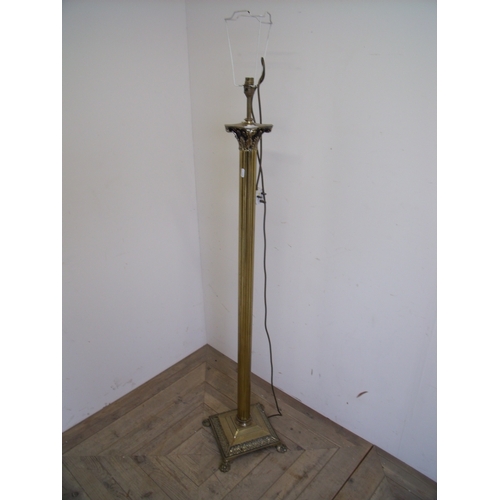 406 - Brass Corinthian column standard lamp on square base and lion paw feet