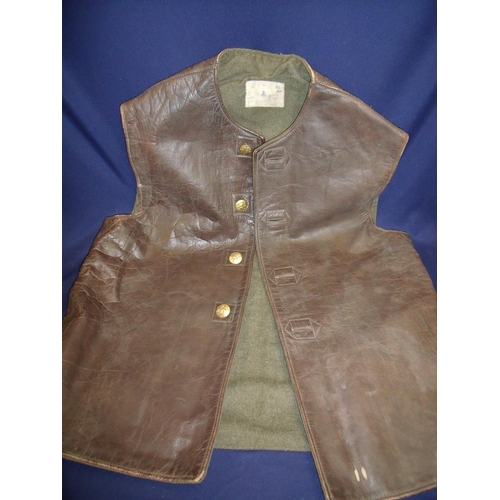18 - Military style leather Jerkin waistcoat with faded label and gilt metal button