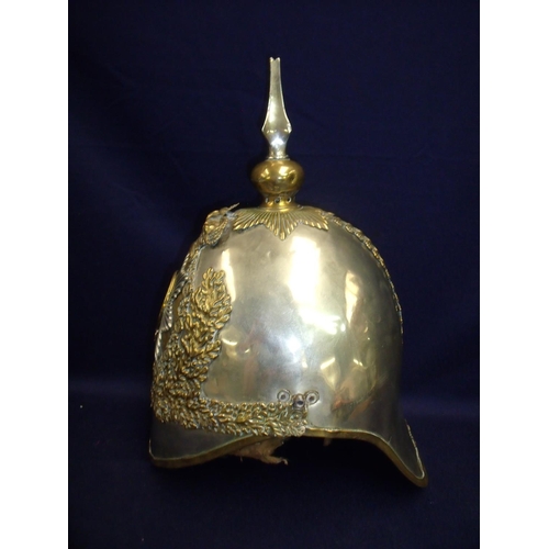 27 - British guards cavalry steel and brass helmet with central crest and raised spire plume finial retai... 