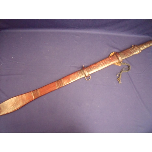 39 - African Tuareg sword with 31 inch double edged part triple fullered blade with bound leather grip an... 