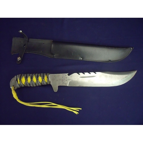46 - Large bladed knife with woven material grip, with 10.5 inch toothpick blade with serrated top with i... 