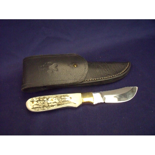 74 - Sheffield made skinning knife with samba horn two piece grip, brass mounts and 3 1/4 inch blade comp... 