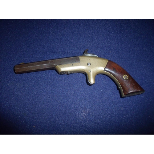 84 - Mahogany cased USA Merwin and Bray rim fire single shot derringer pistol with 3.5 inch octagonal bow... 