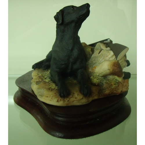 106 - Border Fine Arts figure of a black Labrador and shooting equipment, mounted on wooden plinth