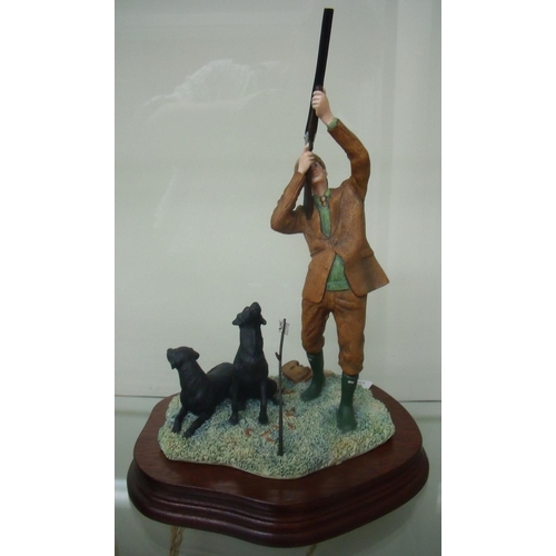 108 - Border Fine Arts figure of a game shooter and two seated Labradors, mounted on wooden plinth