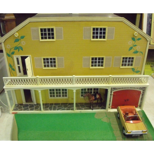 41 - Lundby of Sweden two sectional dolls house lodge and a box containing an extremely large selection o... 