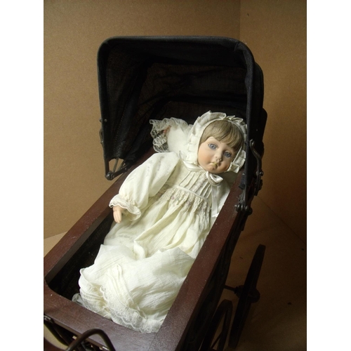 50 - Wooden constructed Victorian style coach built dolls pram with porcelain headed Alberon doll