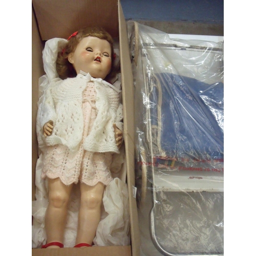 45 - Circa 1950s Pedigree walking doll and associated pram