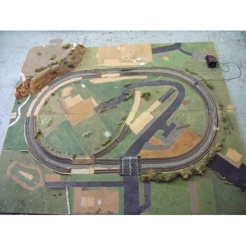 57 - Large four sectional OO gauge railway layout