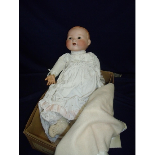 44 - Armand Marseille Germany porcelain headed doll  with solenoid hands with crier, the reverse of the h... 