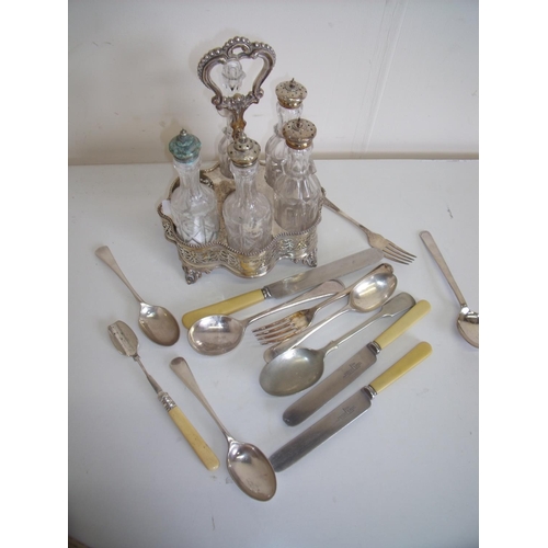 24 - Large selection of various assorted plated cutlery and a six bottle silver plated cruet set with fiv... 