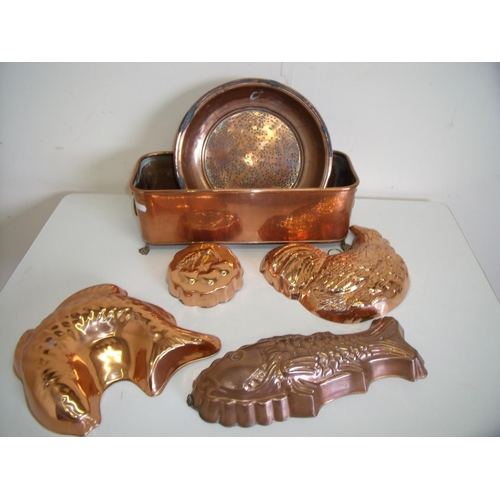 13 - Four reproduction copper animal shaped moulds, a 19th C copper strainer and a rectangular copper pla... 