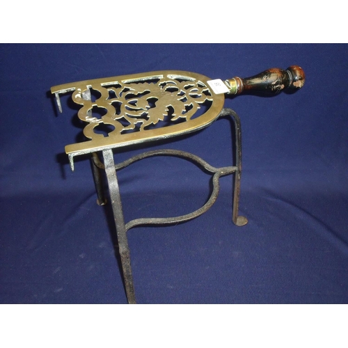 7 - 19th C brass and iron work trivet stand depicting figure of phoenix, with turned wood handle