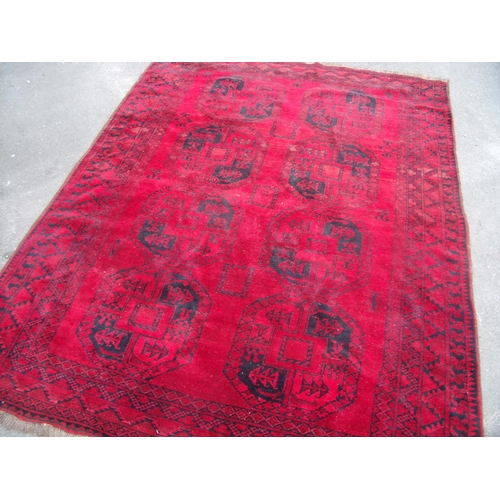 296 - Large red ground Persian style rug (225cm x 180cm)
