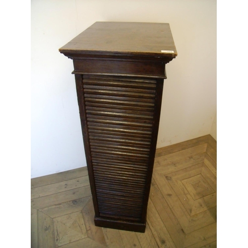 369 - Early 20th C oak eight drawer filing cabinet enclosed by roller door (37cm x 49cm x 116cm)