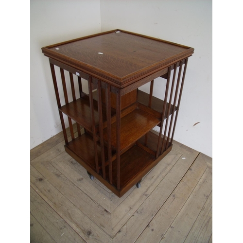 132 - Edwardian oak revolving bookcase (53cm x 53cm x 83cm)