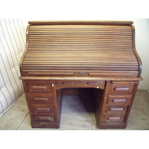 135 - Edwardian oak roll top twin pedestal desk (width 126cm)
