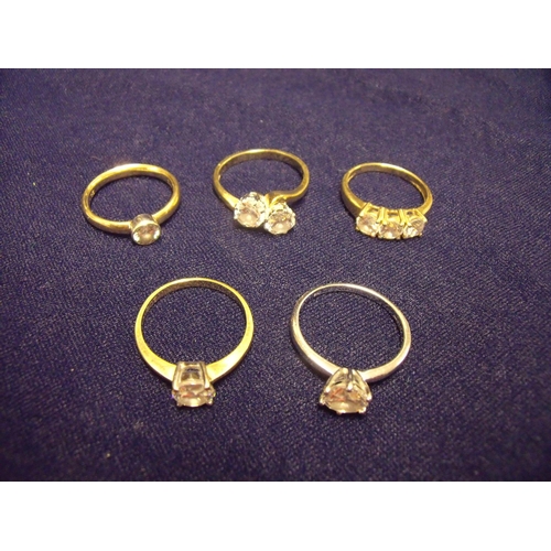 104 - Group of five dress rings, four in 9ct yellow gold set with CZ stones and one 9ct white gold solitai... 