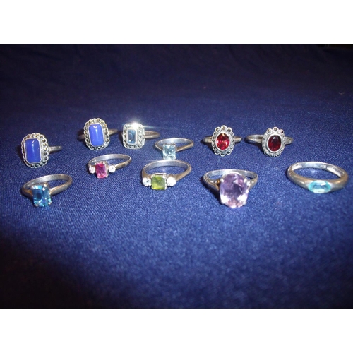 105 - Group of eleven silver dress rings set with various coloured stones, marquisette etc