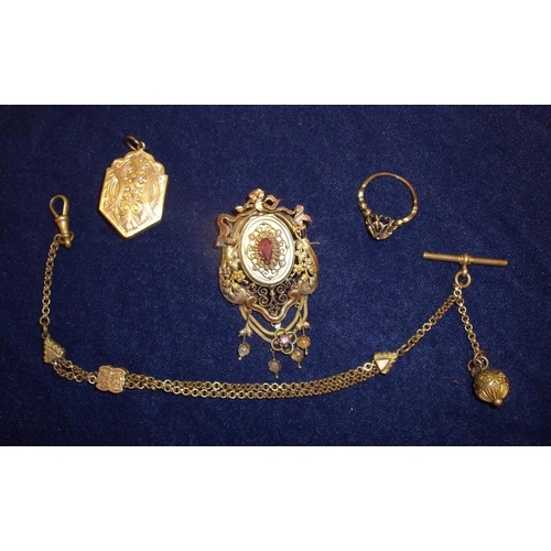 109 - An elaborate and ornate Victorian gilt metal brooch set with central stone and mounted with various ... 