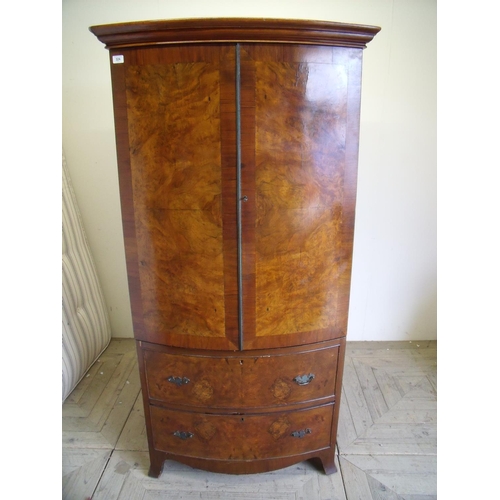 324 - Mid 20th C walnut bow front combination wardrobe with two cupboard doors above two doors (86cm x 60c... 