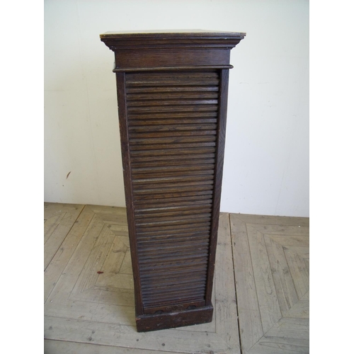 369 - Early 20th C oak eight drawer filing cabinet enclosed by roller door (37cm x 49cm x 116cm)