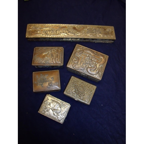 68 - Selection of Chinese/Japanese silver plated and other table boxes, all with various embossed designs... 