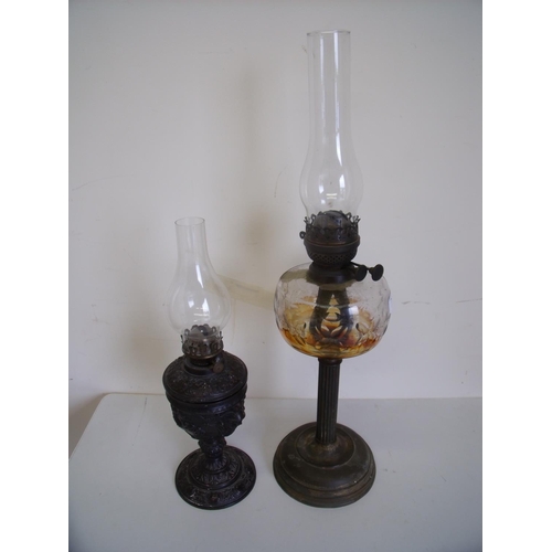 7 - Late Victorian oil lamp with clear glass reservoir and another with embossed spelter type body (2)
