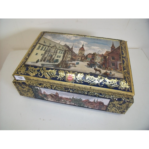 169 - Large embossed E. Otto Schmidt tin with hinged top depicting various town scape scenes (42cm x 30cm ... 
