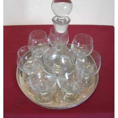 187 - Silver plated circular tray with large heavy glass decanter and seven brandy type goblets