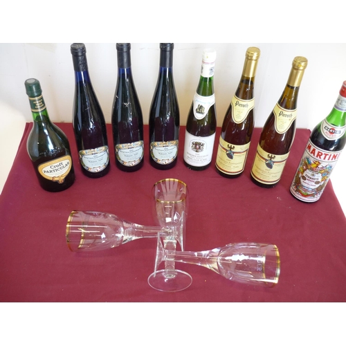 51 - Box containing a selection of various sealed bottles of wine, Martini, large wine goblet, glasses et... 